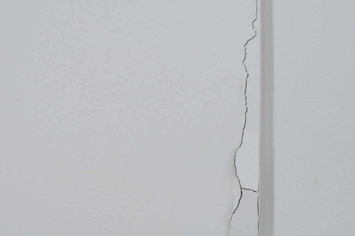 White cracked dry wall in the room.